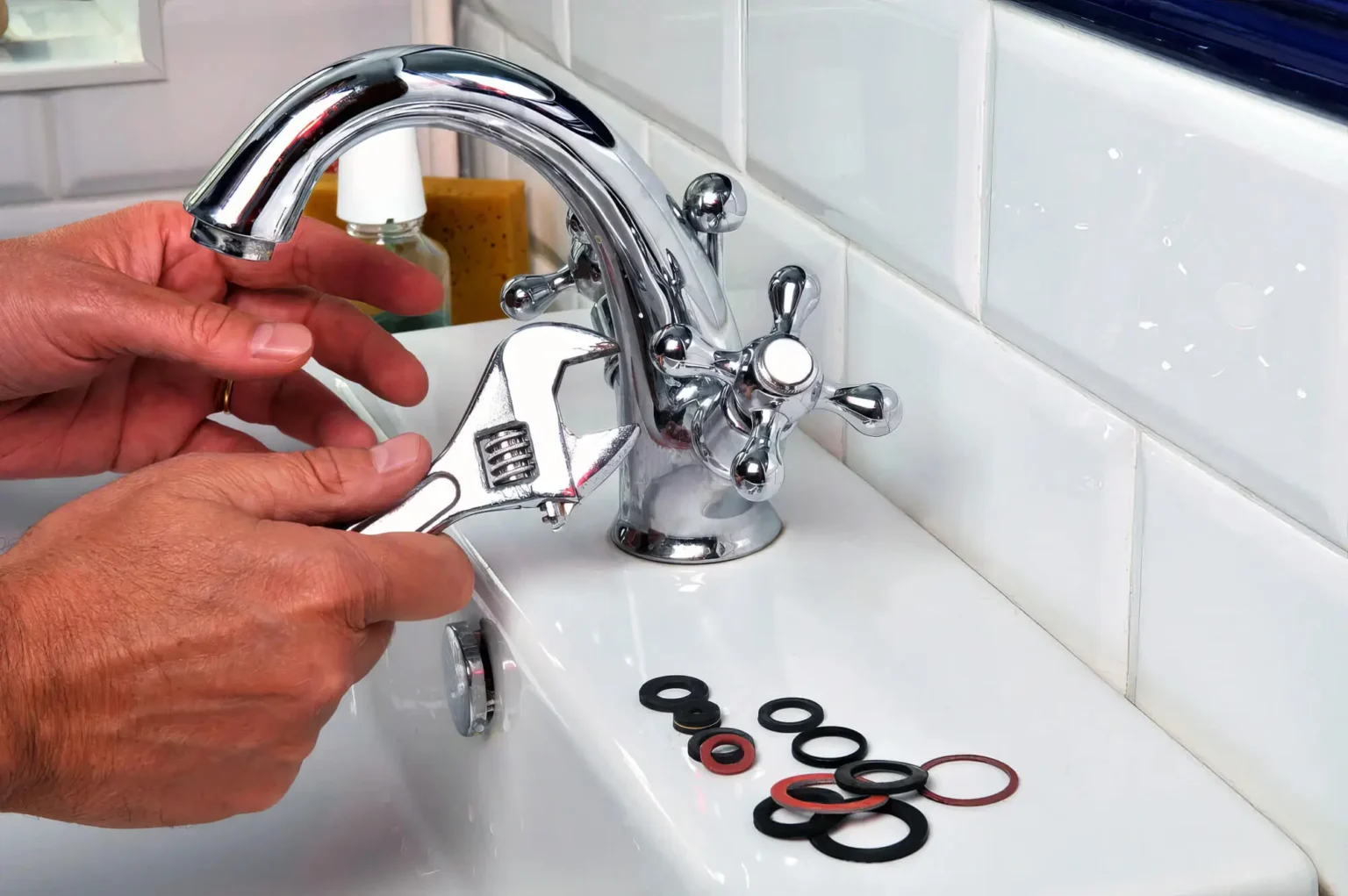 Plumber maintaining a bathroom faucet in South San Francisco